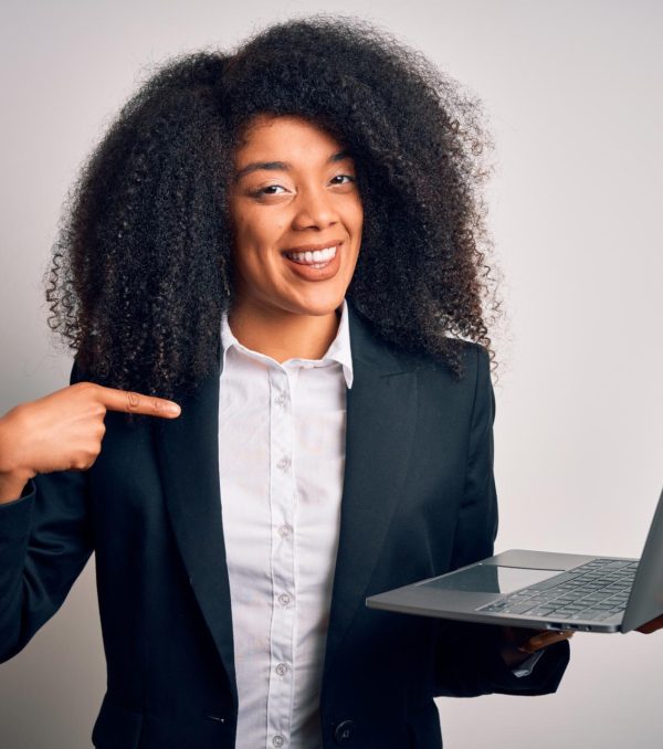 young-african-american-business-woman-with-afro-hair-using-computer-laptop-from-job-with-surprise-face-pointing-finger-himself